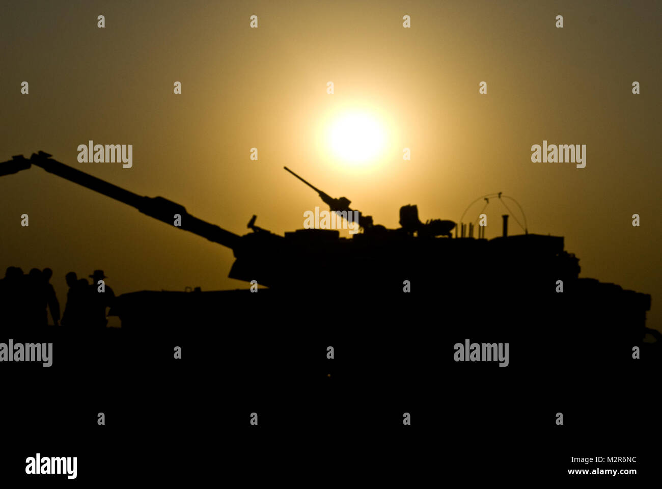 Iraqi tankers tank crewmen from 1st Company, 2nd Regiment, 34th Brigade, 9th Iraqi Army take a few moments to rest after a day of M1A1 live-fire training at the Besmaya Combat Training Center, Sept. 27. The live- fire was a culminating exercise of the Maneuver Collective Training Course where the tankers practice platoon movement techniques in their various platoons to increase crew competency. Iraqi tankers tank by United States Forces - Iraq (Inactive) Stock Photo