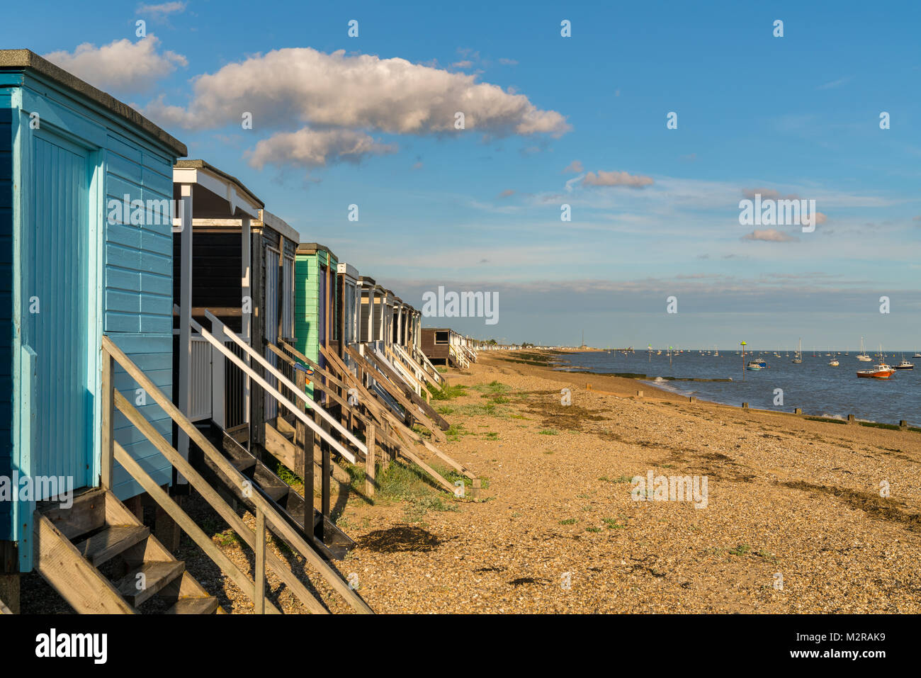 Beach huts on the shore of the River Thames, seen in Southend-on-Sea, Essex, England, UK Stock Photo