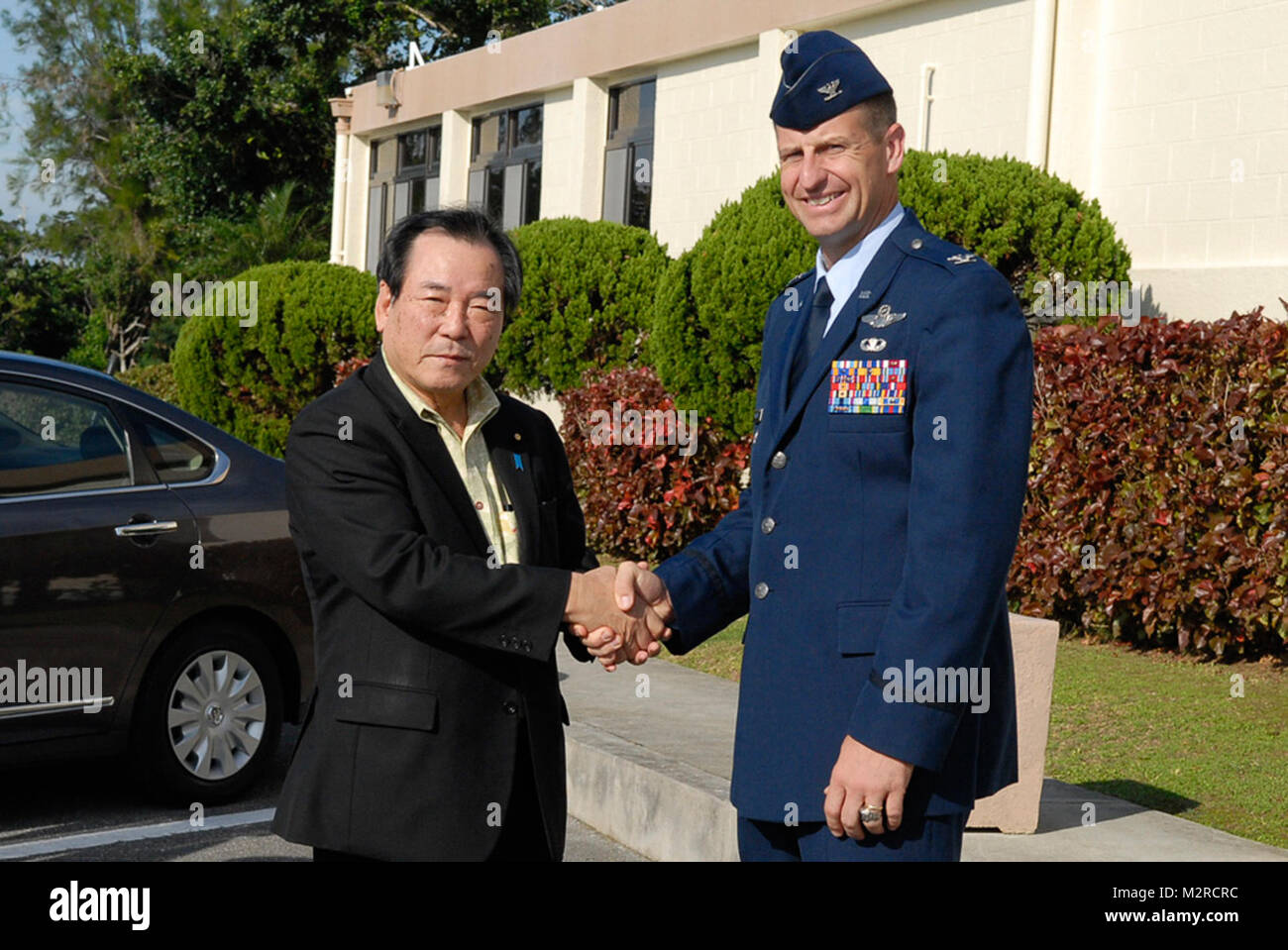 Col. Corey Martin, 18th Wing vice commander, welcomes Yasuo Ichikawa, Japanese Minister of Defense, to Kadena Air Base, Japan, before a briefing and tour of the base Nov. 12, 2011. The minister’s visit to Kadena was to discuss matters concerning the Okinawan people, the mission of the 18th Wing and to be shown first-hand the operations of Kadena during a tour of the flight line. (U.S. Air Force photo by Airman 1st Class Tara A. Williamson/released) 111112-F-LT259-014 by #PACOM Stock Photo