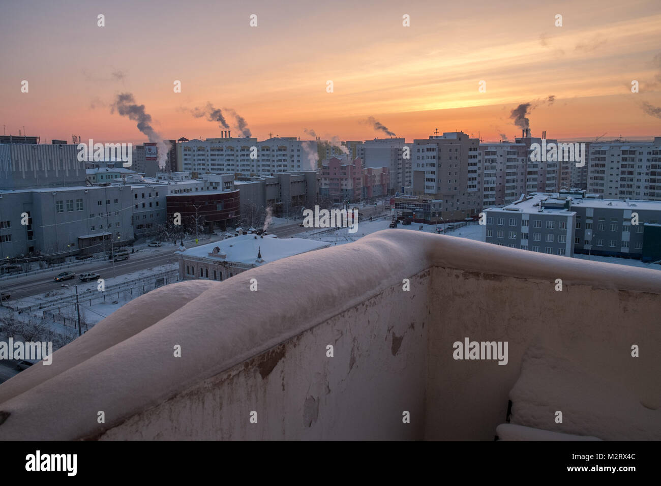 A street scene, seen from the balcony of a building in Yakutsk in Siberia  Yakutsk is a major port on the Lena River. Stock Photo