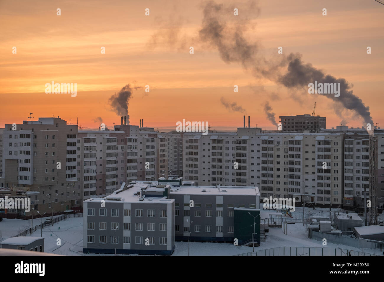 A street scene, seen from the balcony of a building showing apartments