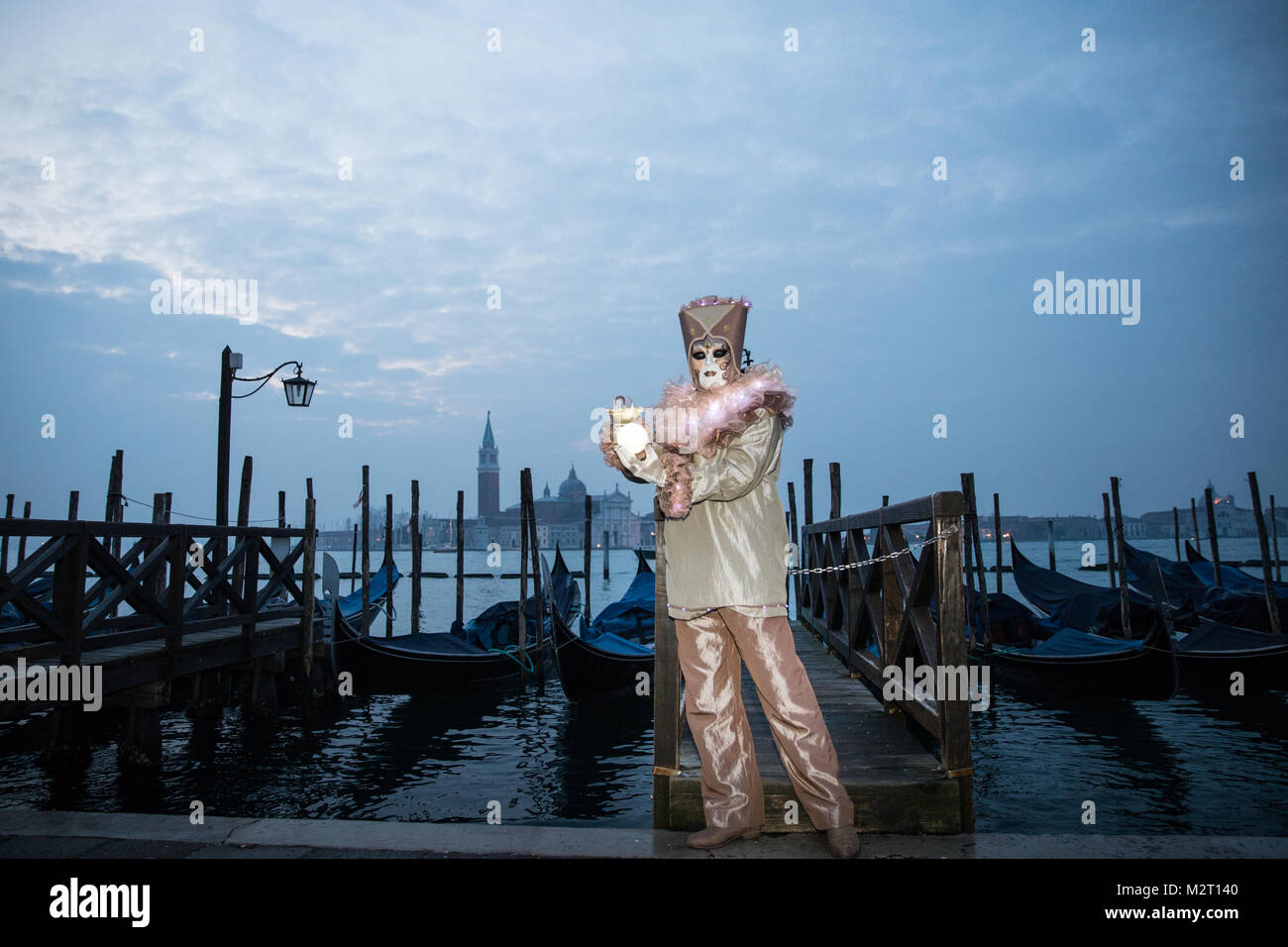 Venice, Italy 8th February, 2018. People in costumes pose by St Mark's Square early morning during Venice Carnival. Credit: Carol Moir / Alamy Live News. Stock Photo