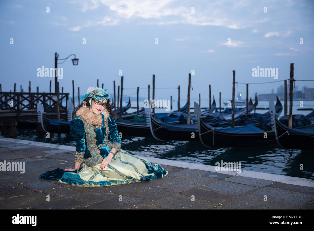 Venice, Italy 8th February, 2018. People in costumes pose by St Mark's Square early morning during Venice Carnival. Credit: Carol Moir / Alamy Live News. Stock Photo