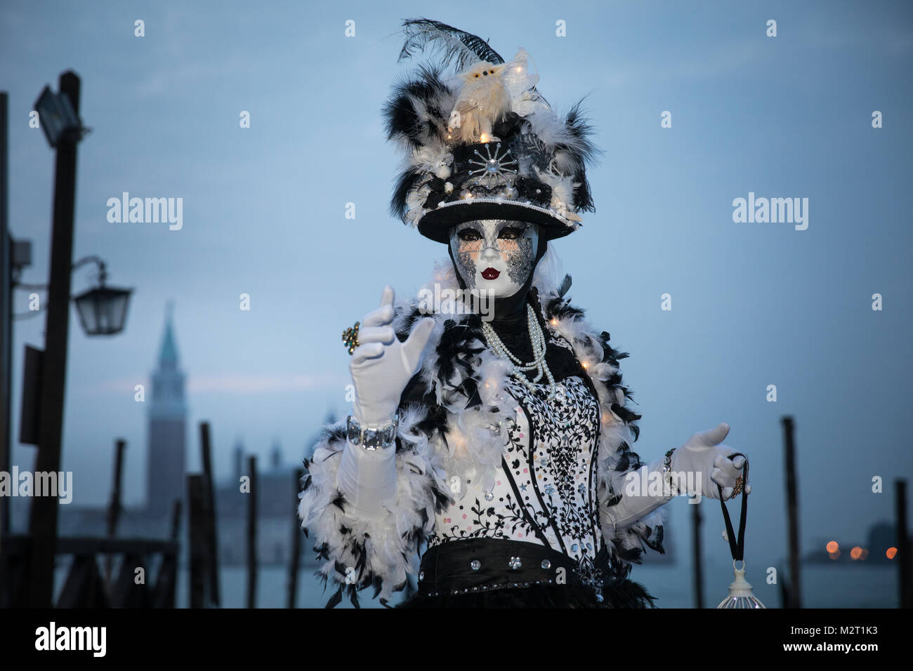 Venice, Italy 8th February, 2018. People in costumes pose by St Mark's Square early morning during Venice Carnival. Credit: Carol Moir / Alamy Live News. Stock Photo