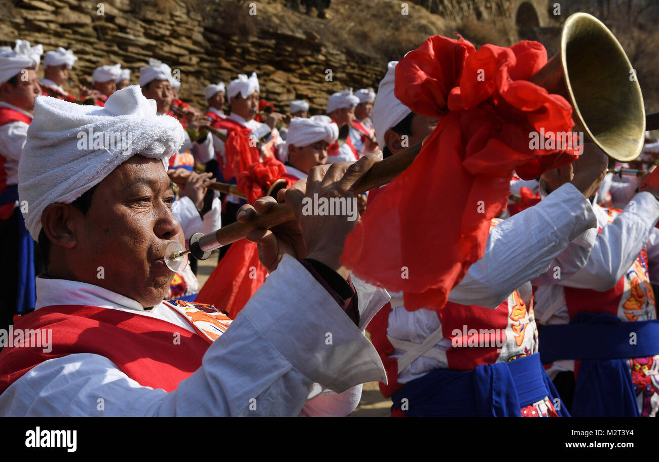 Yulin. 8th Feb, 2018. A suona horn troupe perform in Guojiagou Village