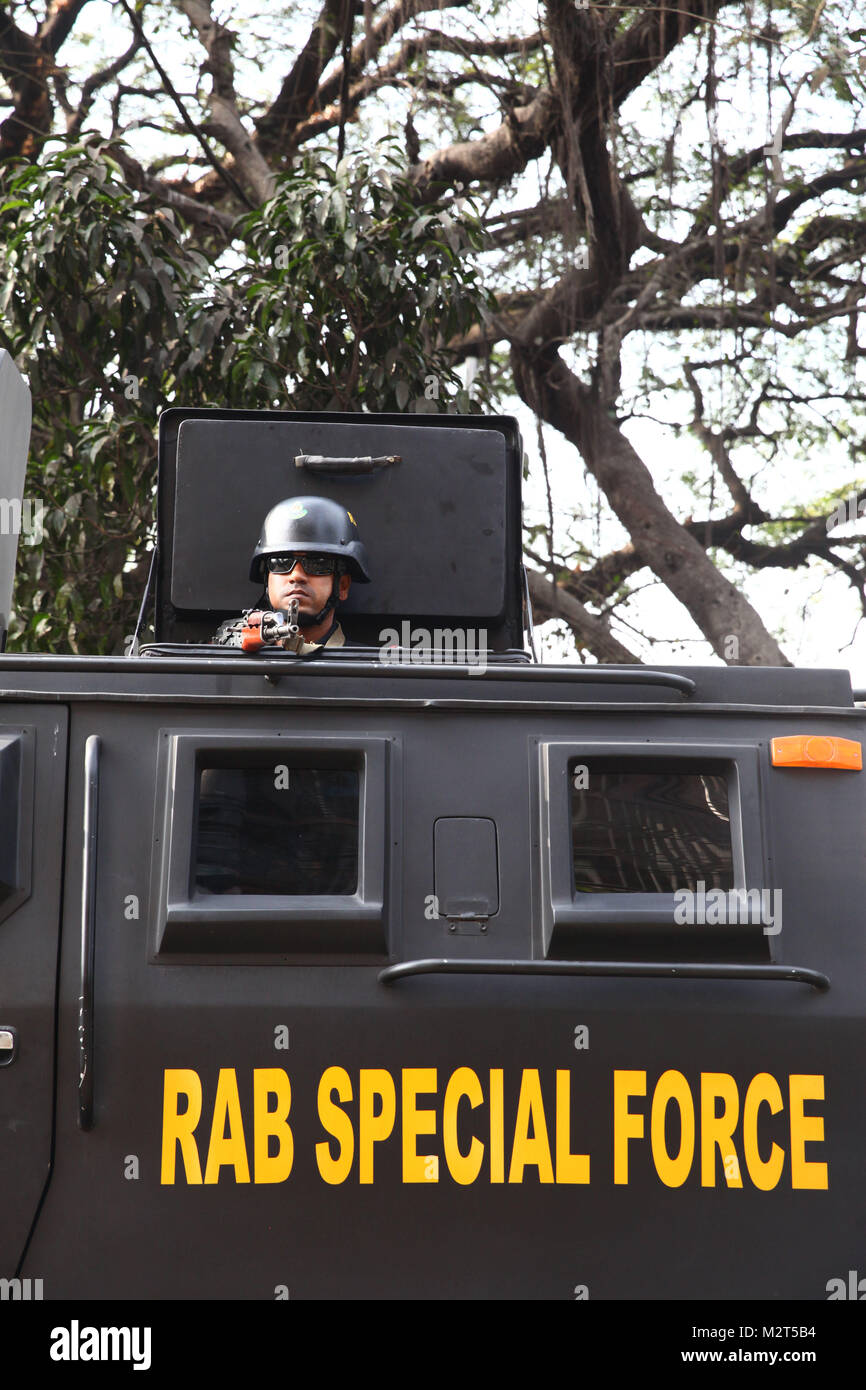 Dhaka, Bangladesh. 8th Feb, 2018. February 08, 2018 Dhaka, Bangladesh - Bangladesh RAB special force member stand guard on the vehicles in the capital Dhaka after the former prime minister and BNP chairperson Khaleda Zia sentenced to five years in prison, in Dhaka, Bangladesh 08 February 2018. BNP leader Khaleda Zia sentenced to five years in prison after a court found her guilty in a corruption case. According to complainant, a grant of 1,255,000 US dollars was transferred from the United Saudi Commercial Bank to the Prime Minister's Orphanage Fund. The then premier Khaleda created the f Stock Photo