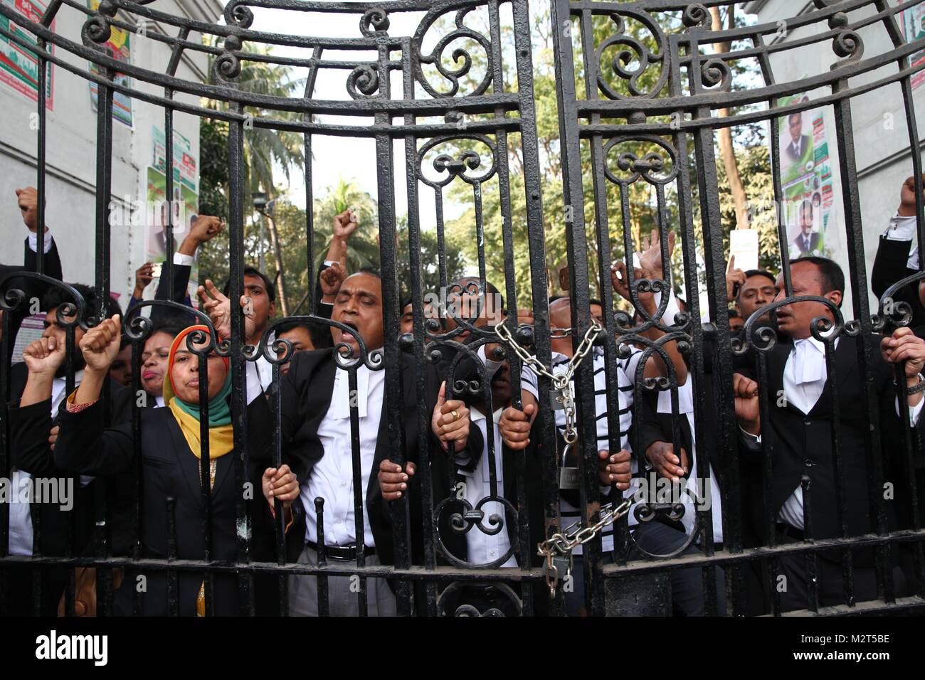 Dhaka, Bangladesh. 8th Feb, 2018. February 08, 2018 Dhaka, Bangladesh - Bangladesh National Party (BNP) lawyers supporter stand inside a locked gate at High Court after the former prime minister and BNP chairperson Khaleda Zia sentenced to five years in prison, in Dhaka, Bangladesh 08 February 2018. BNP leader Khaleda Zia sentenced to five years in prison after a court found her guilty in a corruption case. According to complainant, a grant of 1,255,000 US dollars was transferred from the United Saudi Commercial Bank to the Prime Minister's Orphanage Fund. The then premier Khaleda created Stock Photo