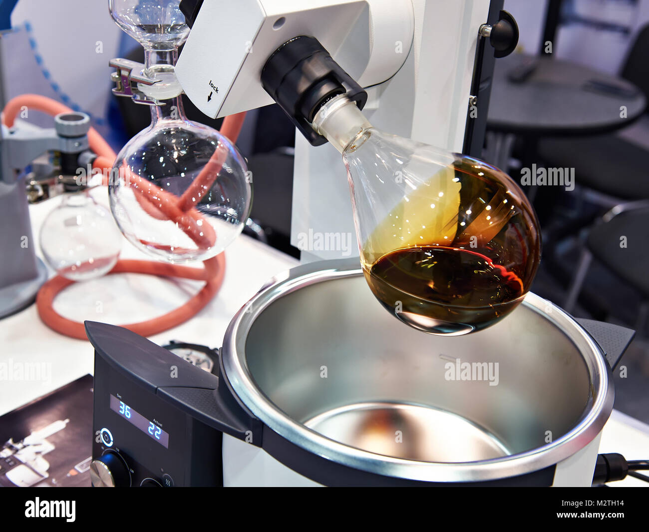 Laboratory rotary evaporator with chemical preparation in a flask Stock