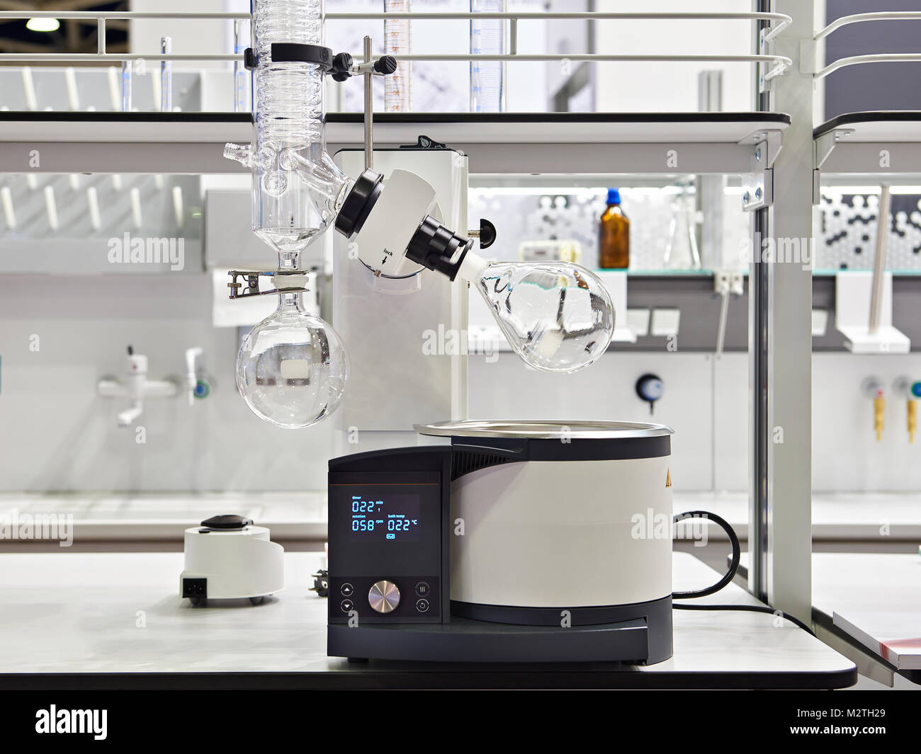 Laboratory rotary evaporator with chemical preparation in a flask Stock