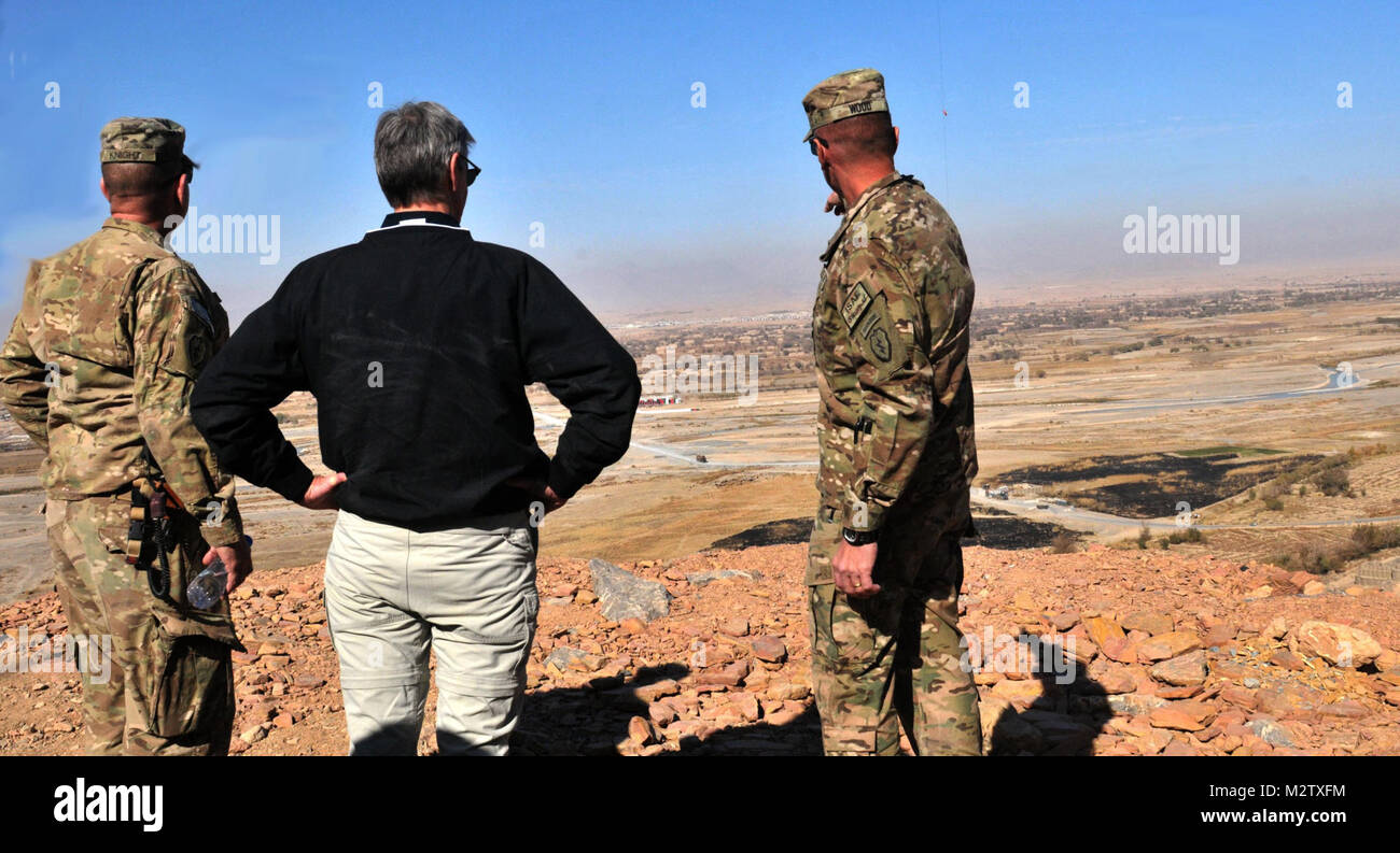 Col Todd Wood, commander of the 1st Stryker Brigade Combat team, 25th Infantry Division, and Command Sgt. Maj. Bernie Knight, CSM of the 1st Stryker Brigade Combat team, 25th Infantry Division, show Secretary of the Army John M. McHugh the view from the top of the mountain surrounding Forward Operating Base Masum Ghar on Dec. 14. US Army photo by Sgt. Michael Blalack, 1/25 SBCT Public Affairs 111214-A-AX238-018 by 1 Stryker Brigade Combat Team Arctic Wolves Stock Photo