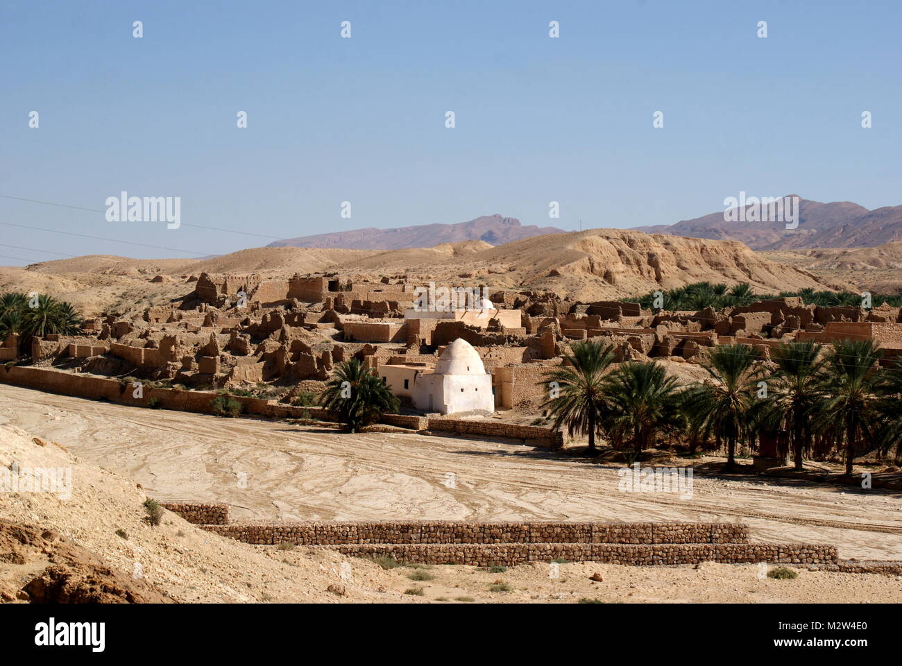 The dry riverbed and abandoned old town of Tamerza, the largest mountain oasis in Tunisia, Tamerza, Tunisia Stock Photo