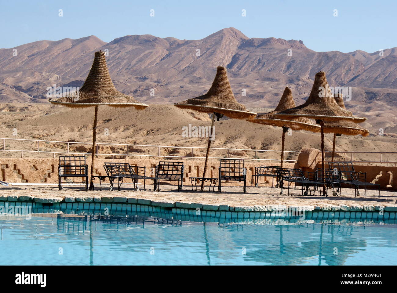 Tamerza Palace Hotel pool with a mountain view, Tamerza, Tunisia Stock Photo