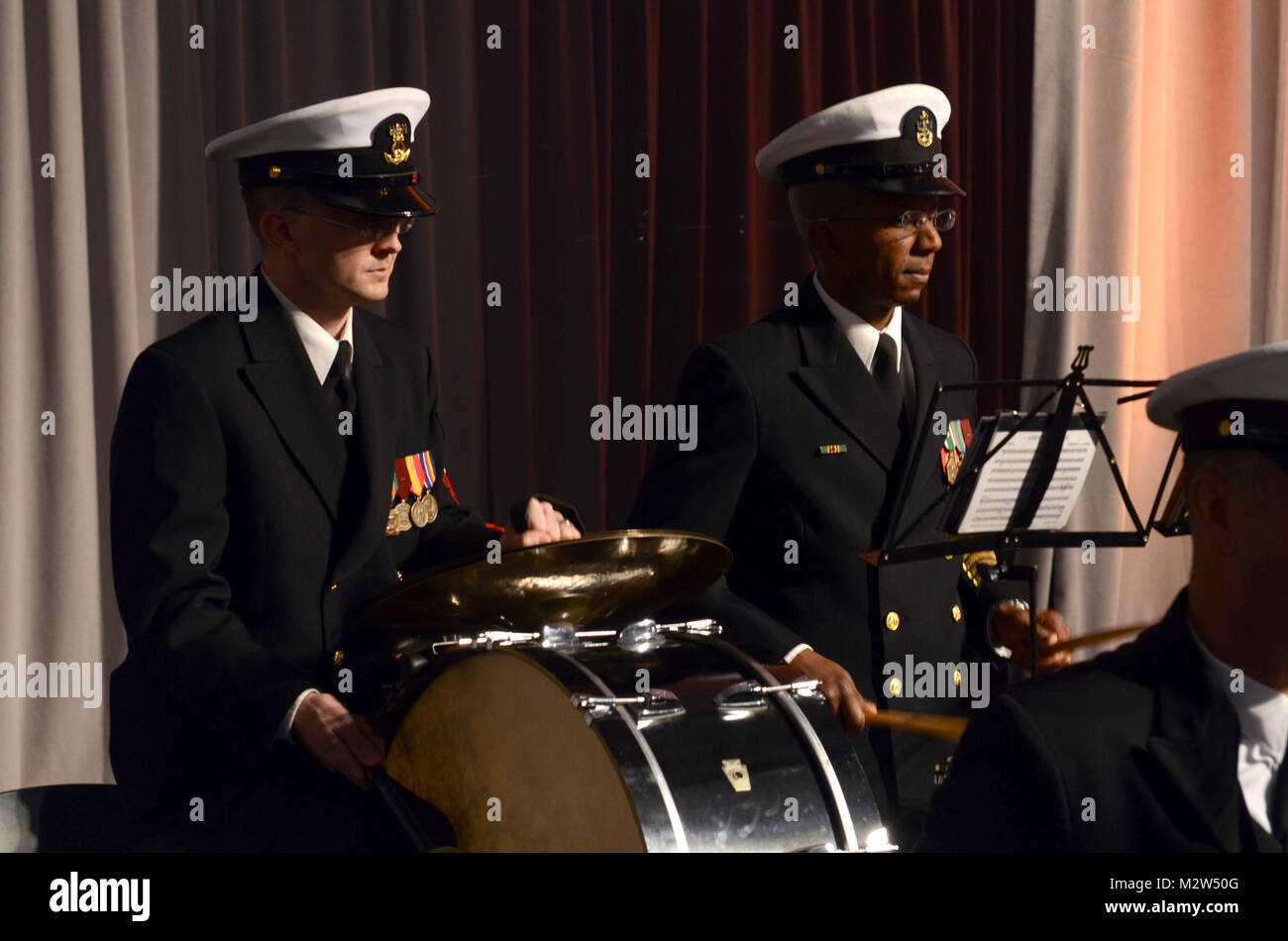 120222-N-HG258-060 WASHINGTON, D.C. (February 22, 2012) Musician 1st Class Randy Johnson, left and Chief Musician Stacy Loggins of the U.S. Navy Ceremonial Band perform preliminary patriotic music at the opening of the Groundbreaking Ceremony of the Smithsonian's African-American Museum of History and Culture. The ceremony was emceed by actress and singer Phylicia Rashad and featured remarks by former First Lady Laura Bush and President Barack Obama. The event featured music by opra singer Denyce Graves and the Navy Band. The Museum is the only national museum devoted exclusively to the docume Stock Photo