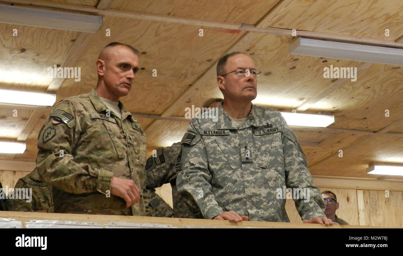 Col. Todd Wood, Commander of the 1st Stryker Brigade Combat Team, 25th Infantry Division, gives Gen. Keith Alexander, Director of the National Security Agency, a tour of the Tactical Operations Center at Forward Operating Base Masum Ghar on March 10. (U.S. Army photo by Sgt. Michael Blalack, 1/25 SBCT Public Affairs.) 120310-A-AX238-002 by 1 Stryker Brigade Combat Team Arctic Wolves Stock Photo