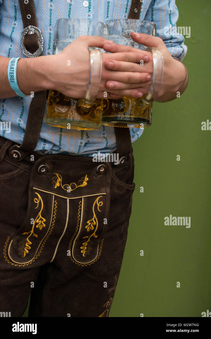 Man in national costume with Oktoberfest beer, Munich Stock Photo