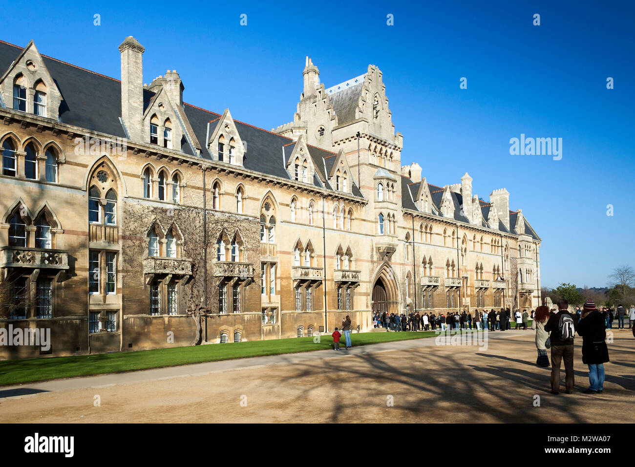Oxford, Oxfordshire, UK - February 16, 2008: Christ church college university building in Oxford with queuing visitors on a clear sky winter day Stock Photo
