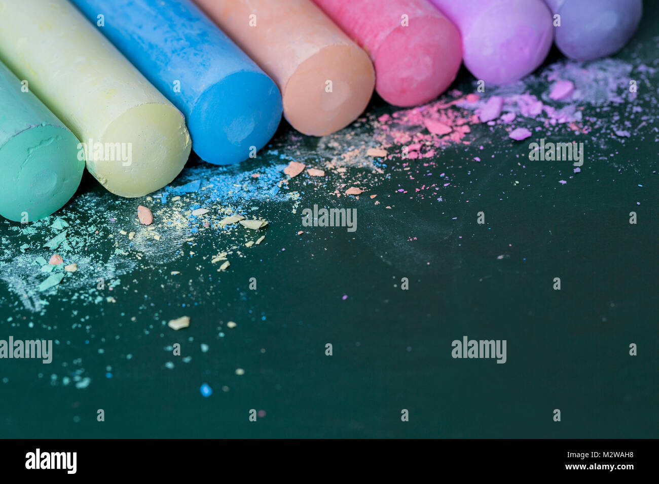 Multicolored crayons, pastel. Green, yellow, pink, purple, blue