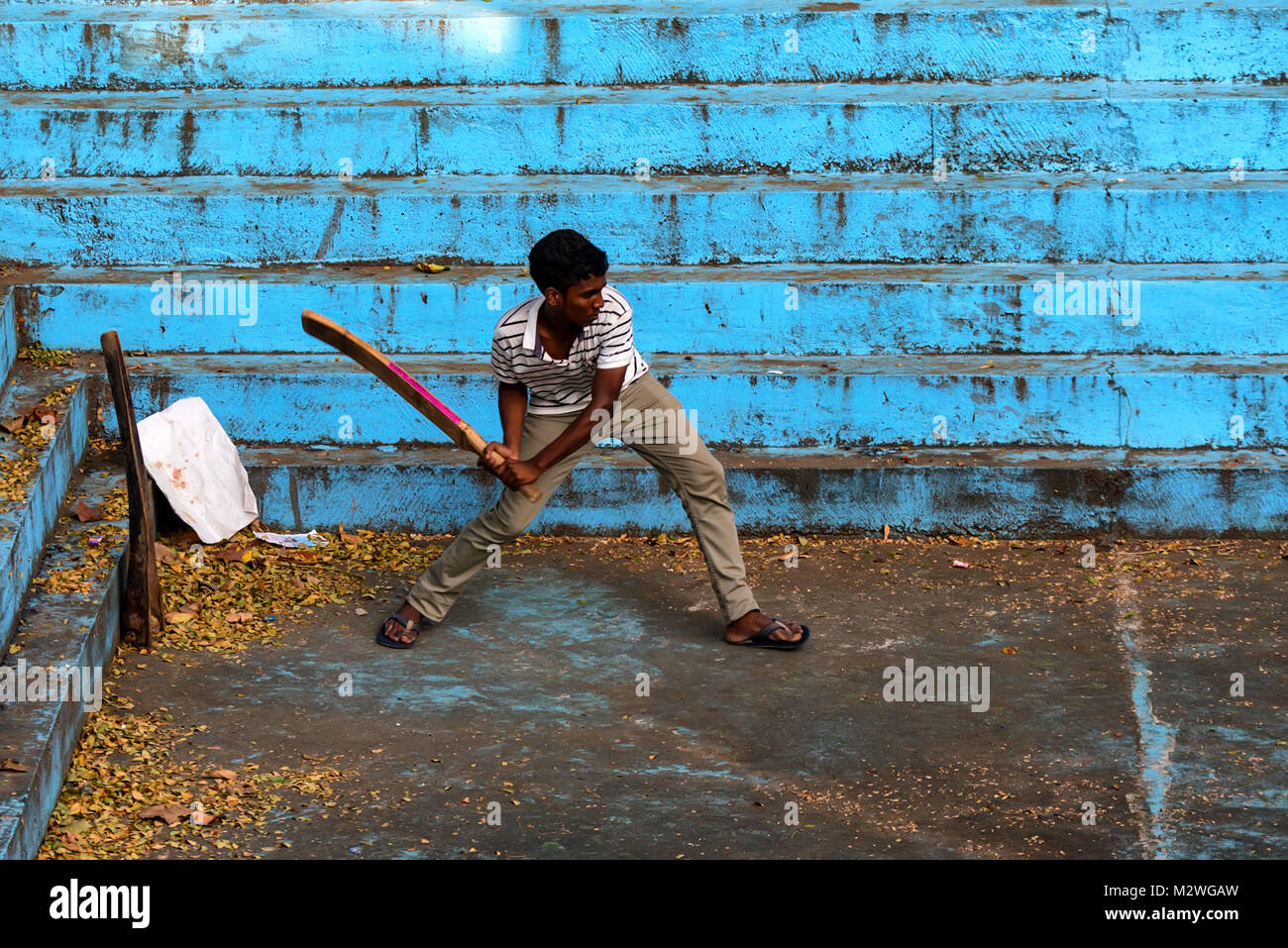 BENTOTA, SRI LANKA - CIRCA DECEMBER 2016: Sri Lankan man plays cricket Stock Photo