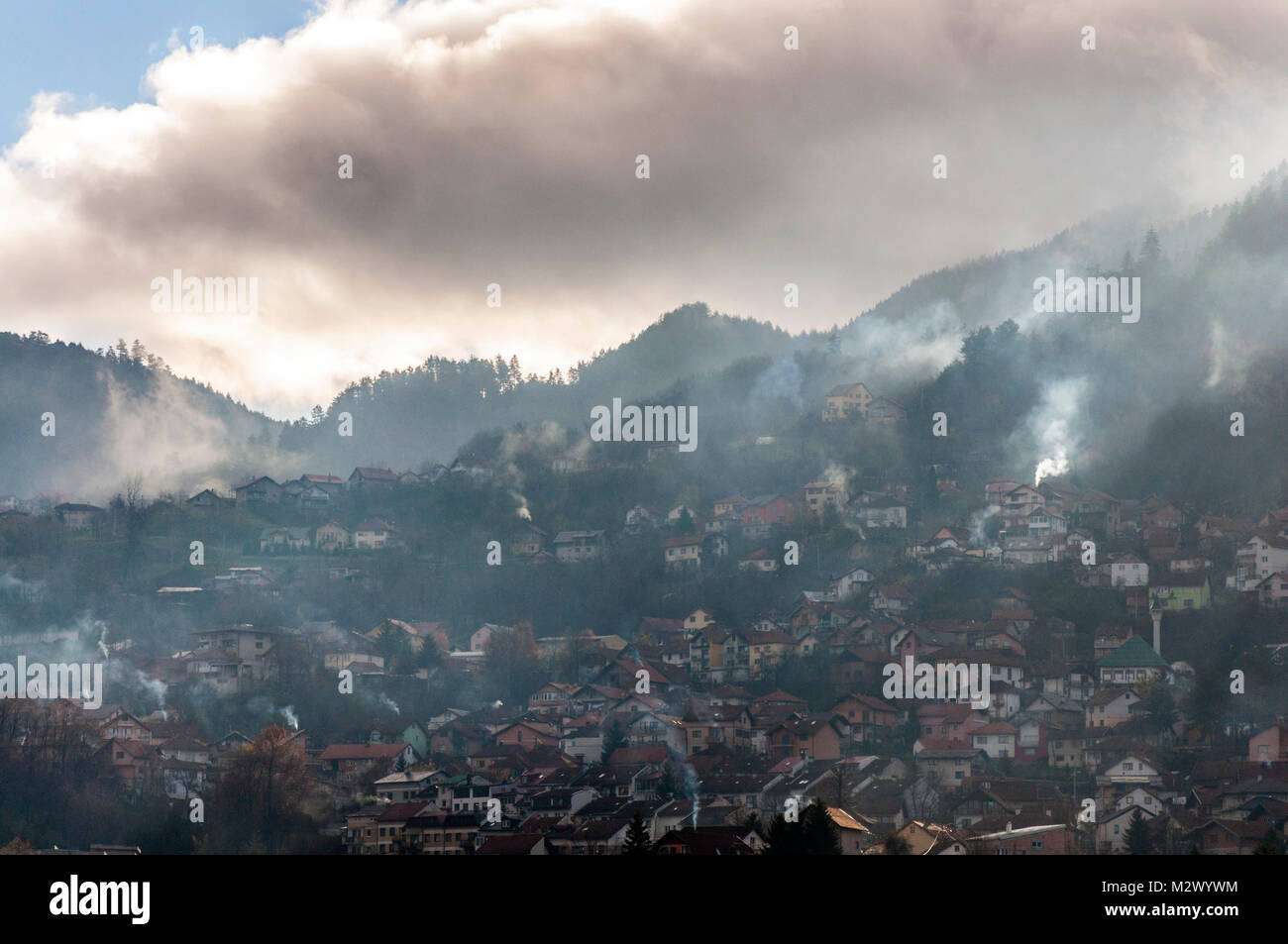 Early morning light in Sarajevo, Bosnia Hercegovina, Former Yugoslavia domestic fire smoke in surrounding hills Stock Photo