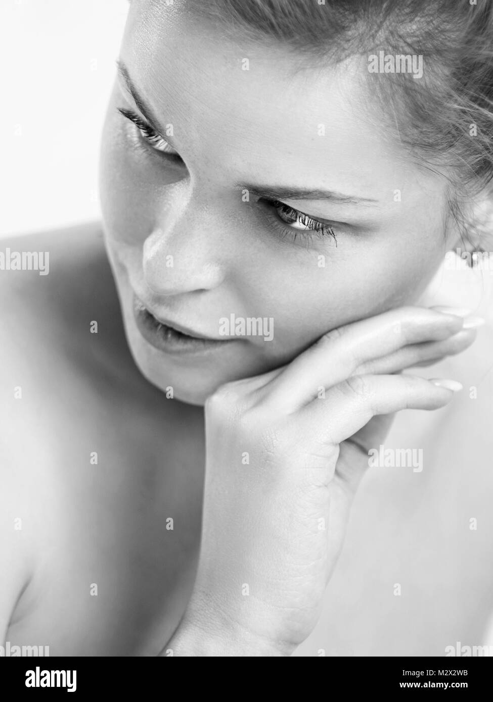 Portrait of a beautiful young woman. Female face close up. Black and white photo Stock Photo