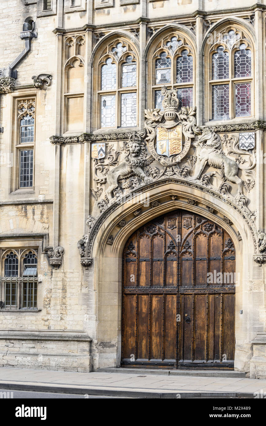 Elaborate royal sculpture above the woden entrance door to Brasenose college on the High street at the university in the city of Oxford, England. Stock Photo