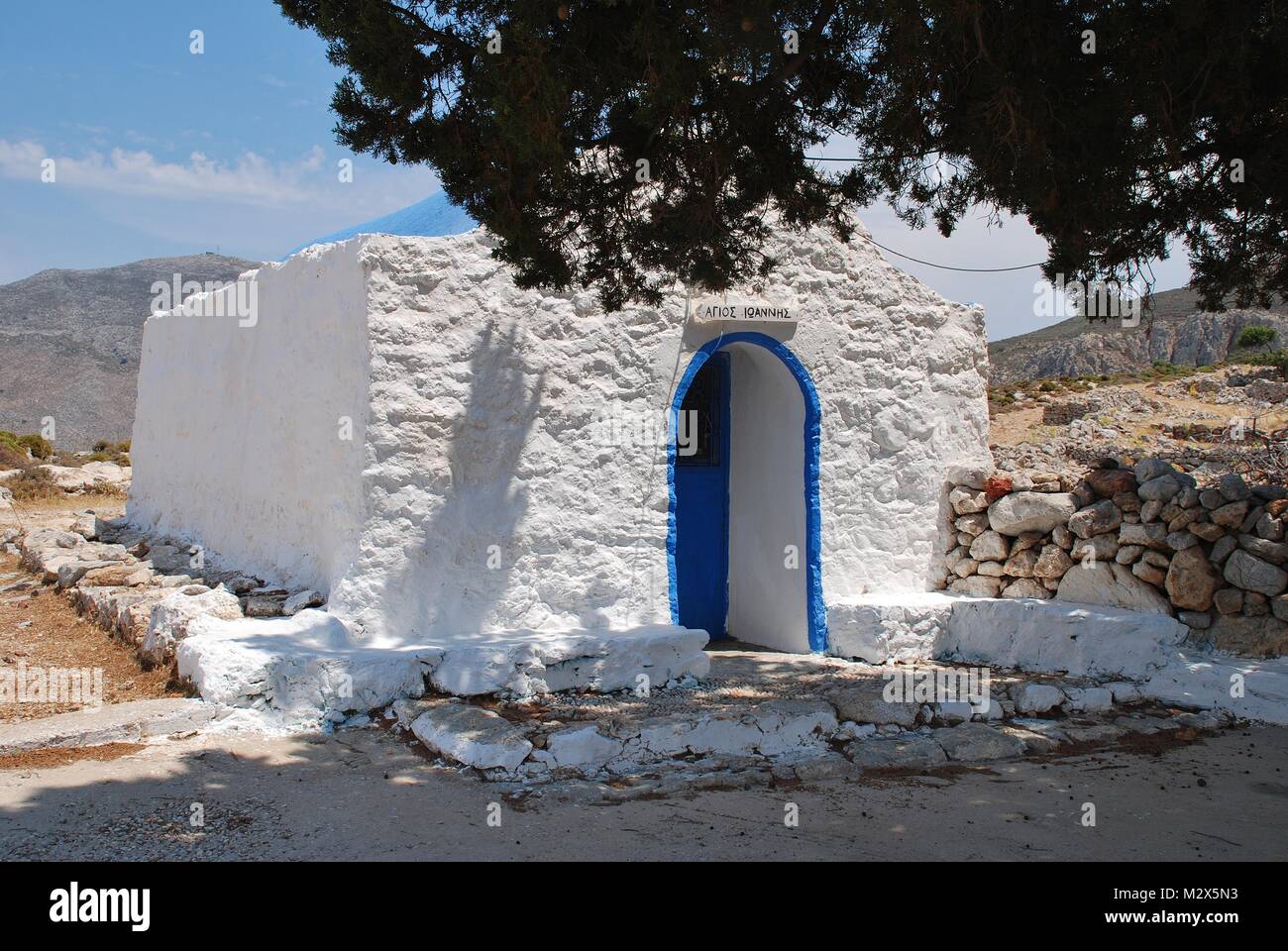 The church of Agios Ioannis (Saint John) by the track to Gera at Livadia on the Greek island of Tilos. Stock Photo