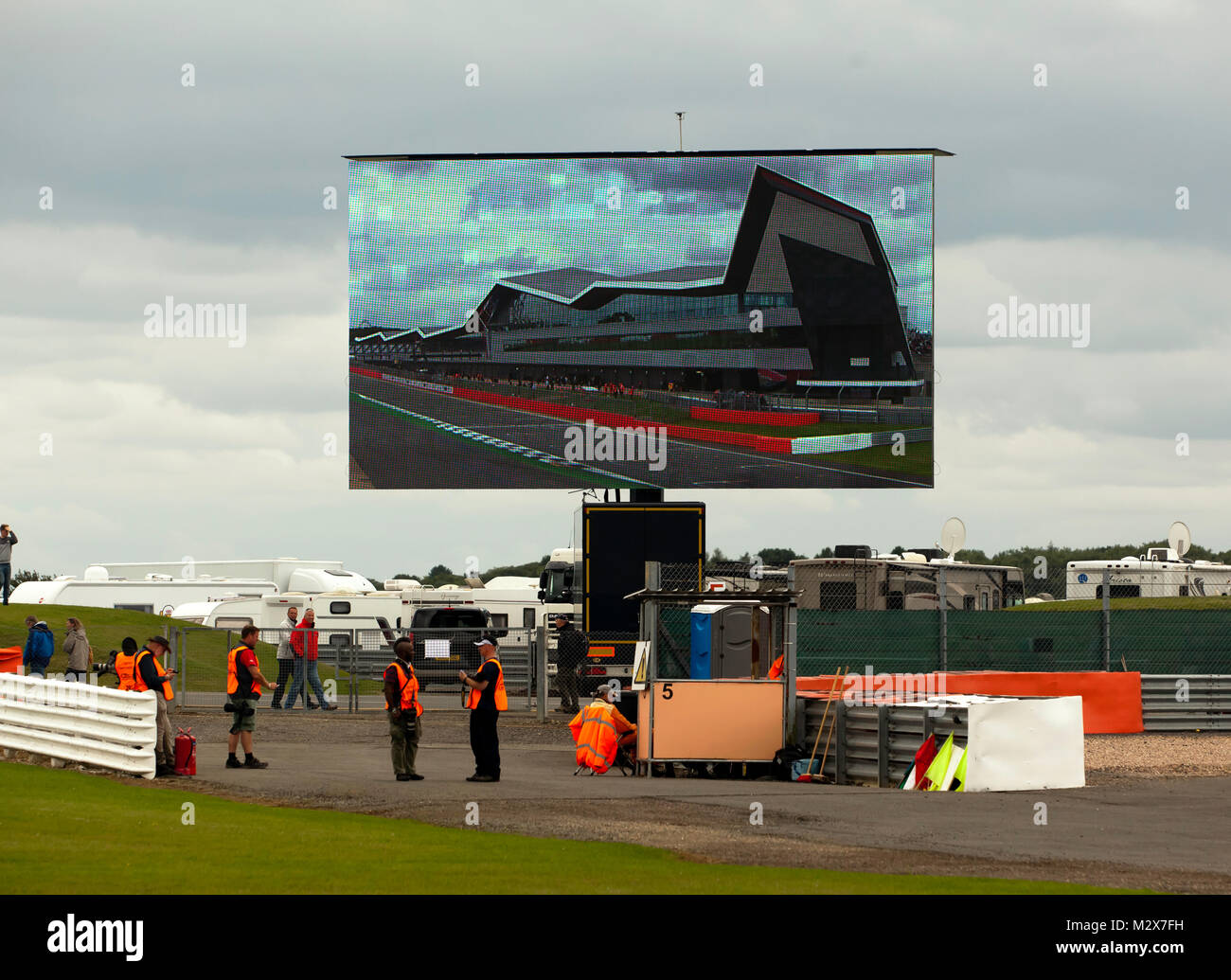 View of a Marshals station  and a  large video screen, showing the' Wing',  during a lull in the action,  at the 2017 Silverstone Classic Stock Photo