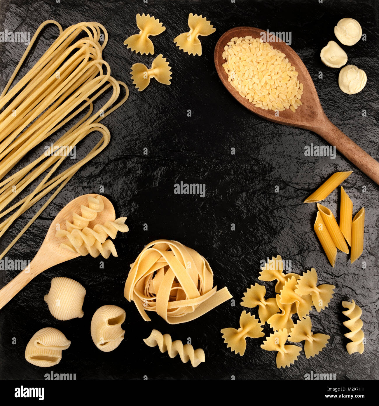 Overhead photo of different types of pasta on black Stock Photo - Alamy