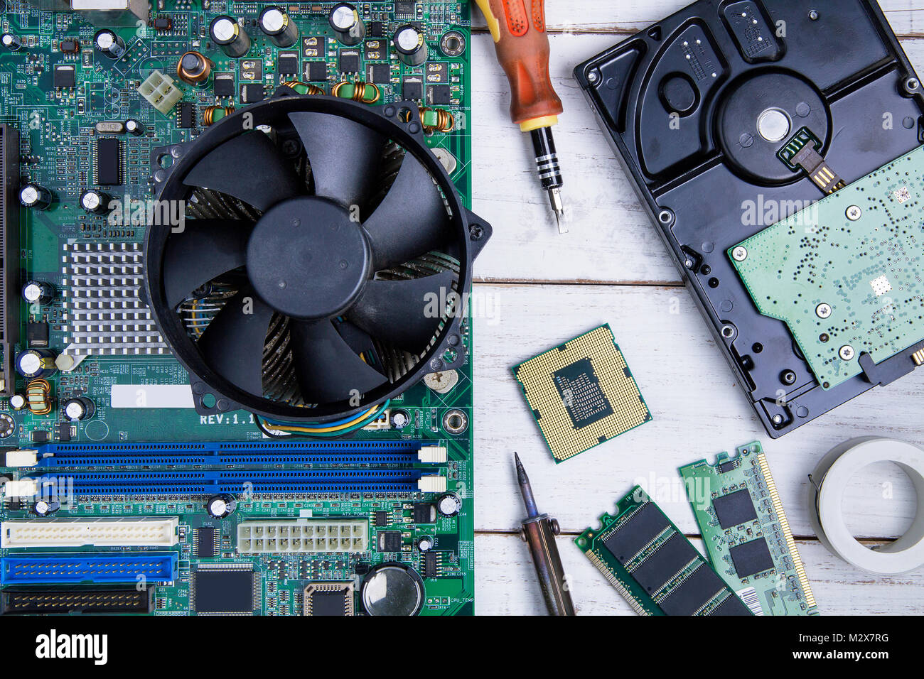 Computer motherboard, Computer Parts, Hard disk, Ram and equipment repair  on the white wooden background Stock Photo - Alamy