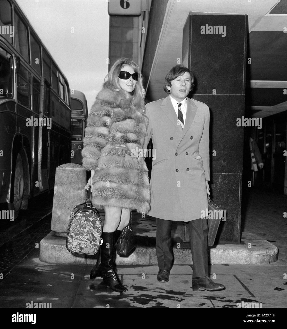 Sharon Tate, 23-year-old American actress and her bridegroom, Roman Polanski, as they left Heathrow Airport, London, for Paris. Stock Photo