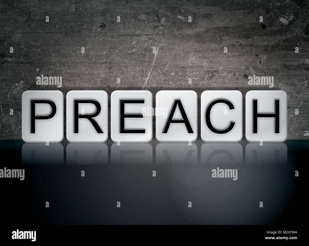 The word Preach concept and theme written in white tiles on a dark background. Stock Photo