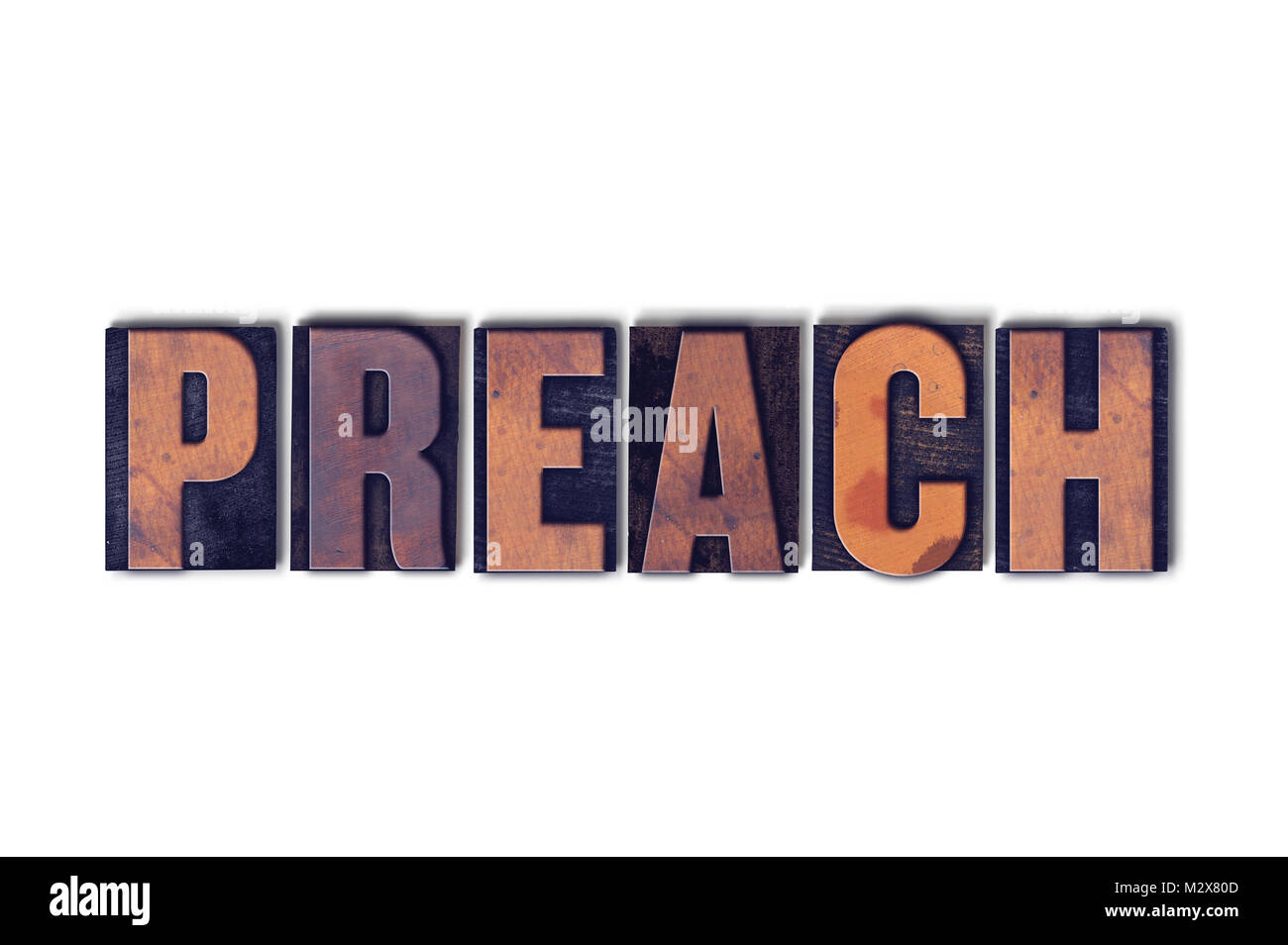The word Preach concept and theme written in vintage wooden letterpress type on a white background. Stock Photo