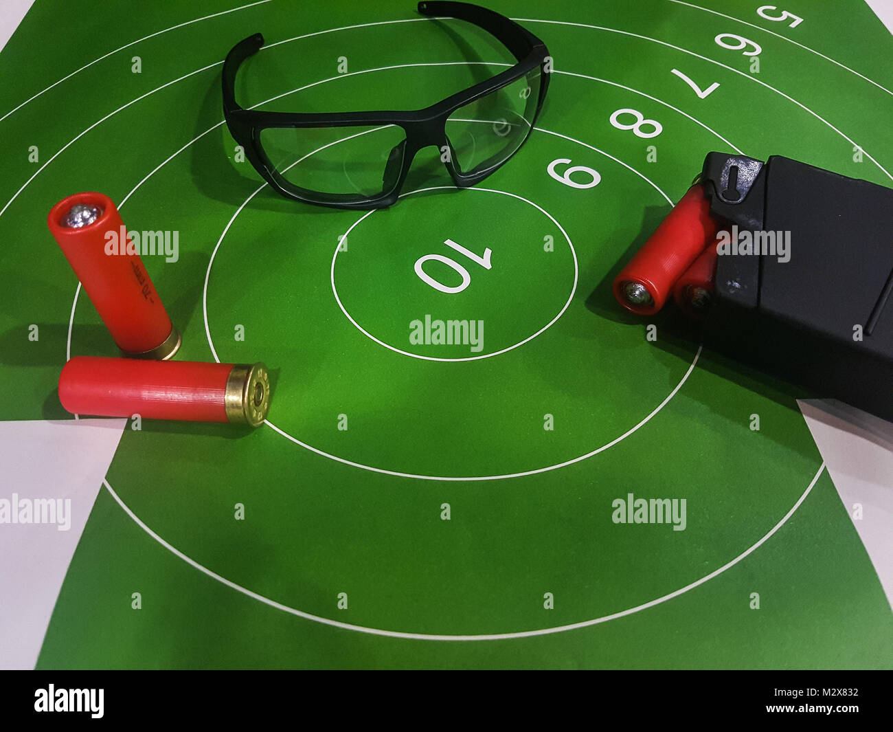 Image of shooting gallery with target, glasses, gun Stock Photo Alamy