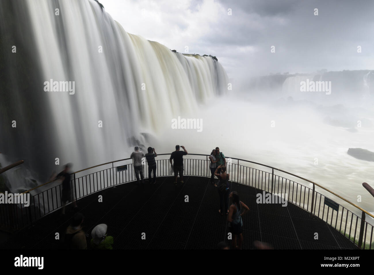 people taking photos at The Iguazu Falls, Brazil Stock Photo