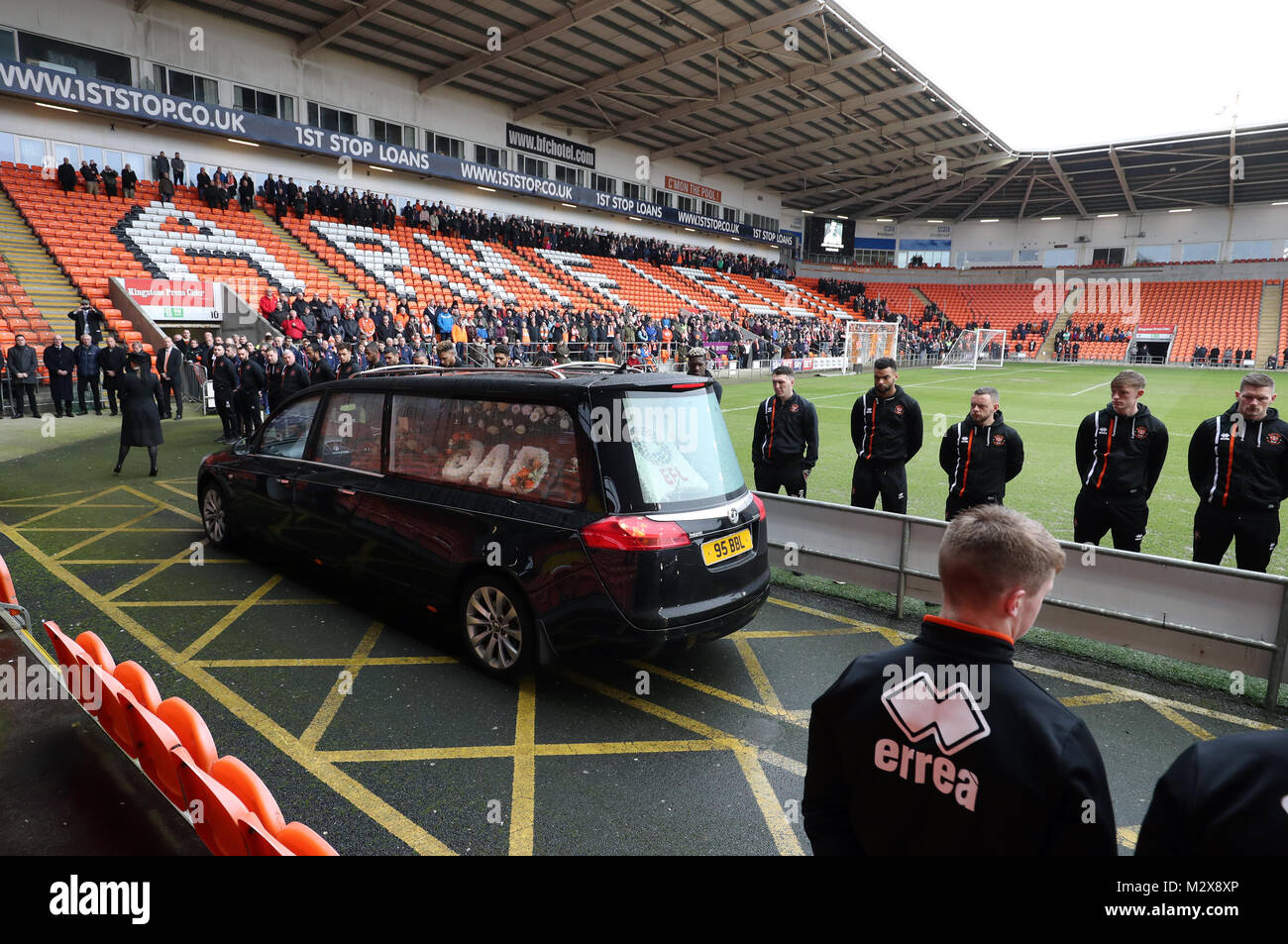 Blackpool players line up as the funeral cortege for Jimmy Armfield