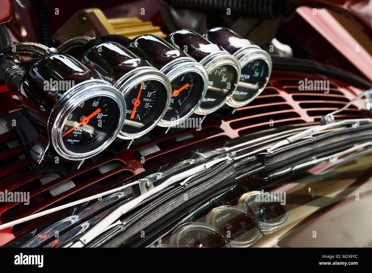 external gauges mounted on the hood of a muscle car Stock Photo Alamy