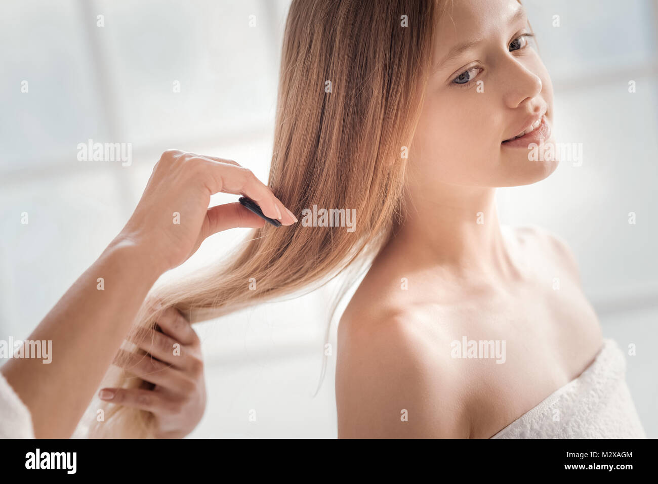 Woman having her hair combed hi-res stock photography and images - Alamy