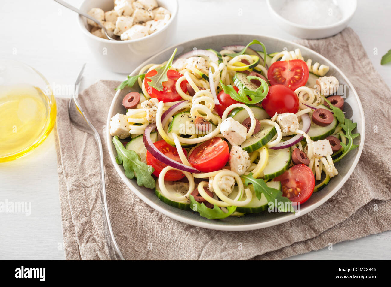 spiralized courgette salad greek style with tomato feta olives cucumber Stock Photo