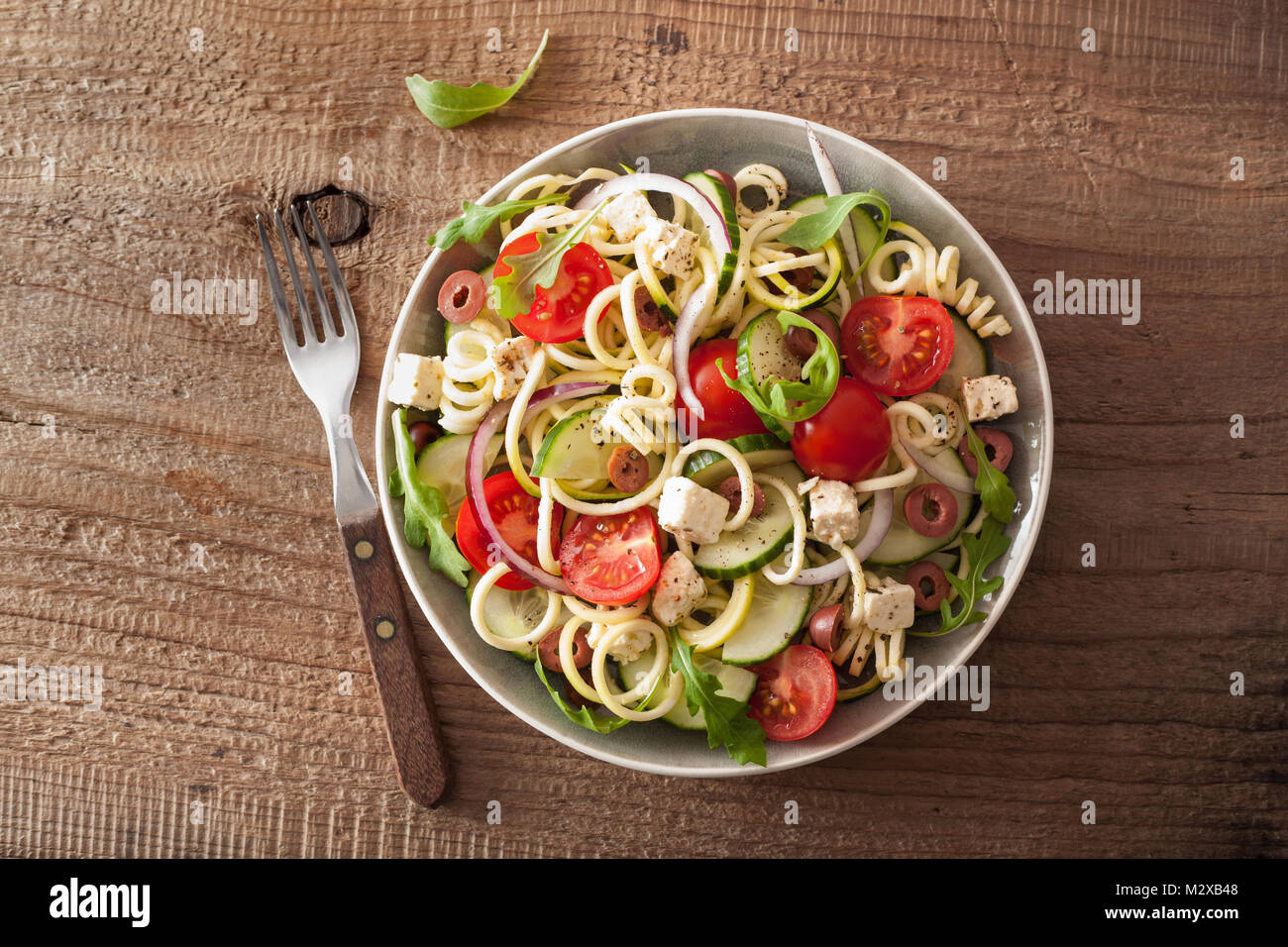 spiralized courgette salad greek style with tomato feta olives cucumber Stock Photo