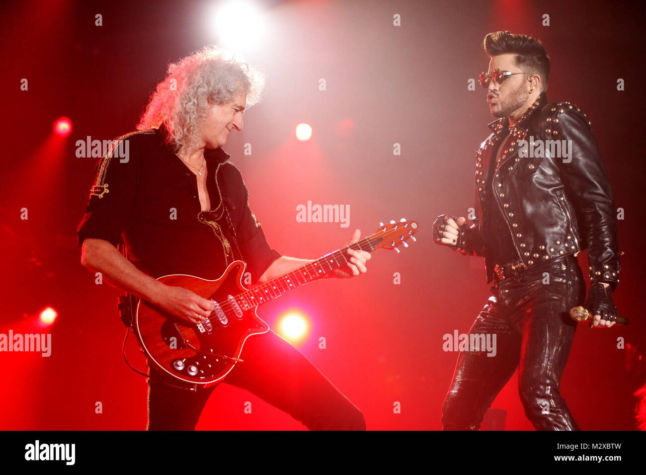 Frankfurt, Germany. 7th Feb, 2015. Queen + Adam Lambert, collaboration between the active members of the British rock band Queen (Brian May and Roger Taylor) and American vocalist Adam Lambert. Concert at Festhalle Frankfurt, Germany. Here: Brian May, Adam Lambert. Credit: Christian Lademann Stock Photo