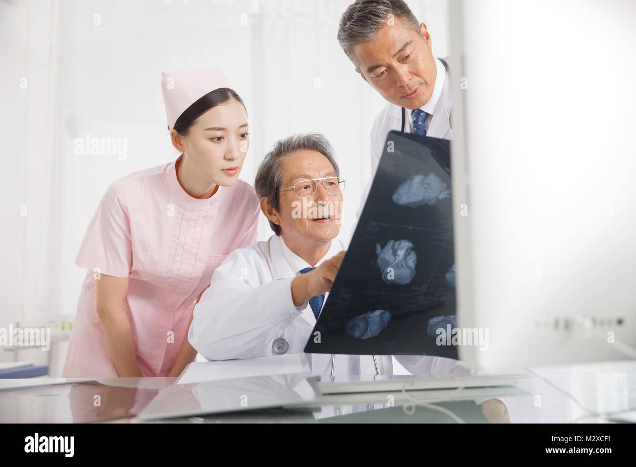 The doctor on the discussion of xrays Stock Photo Alamy