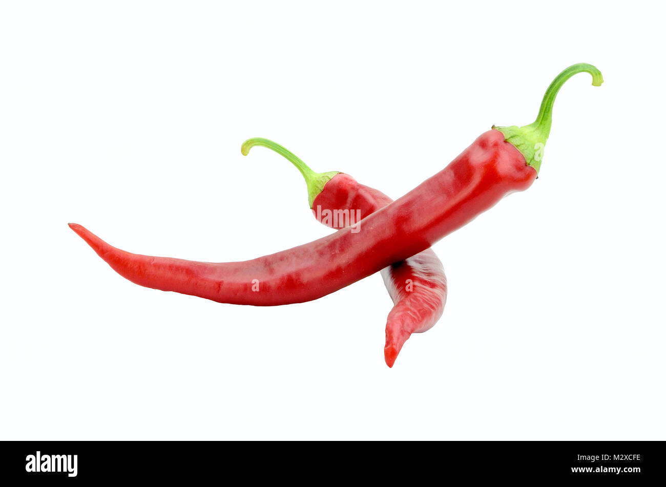 Two red hot chili peppers isolated on white background Stock Photo - Alamy