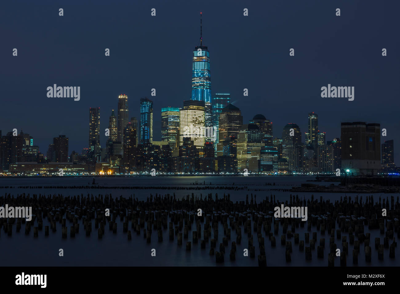 New York City Manhattan downtown skyline at night over Hudson River ...