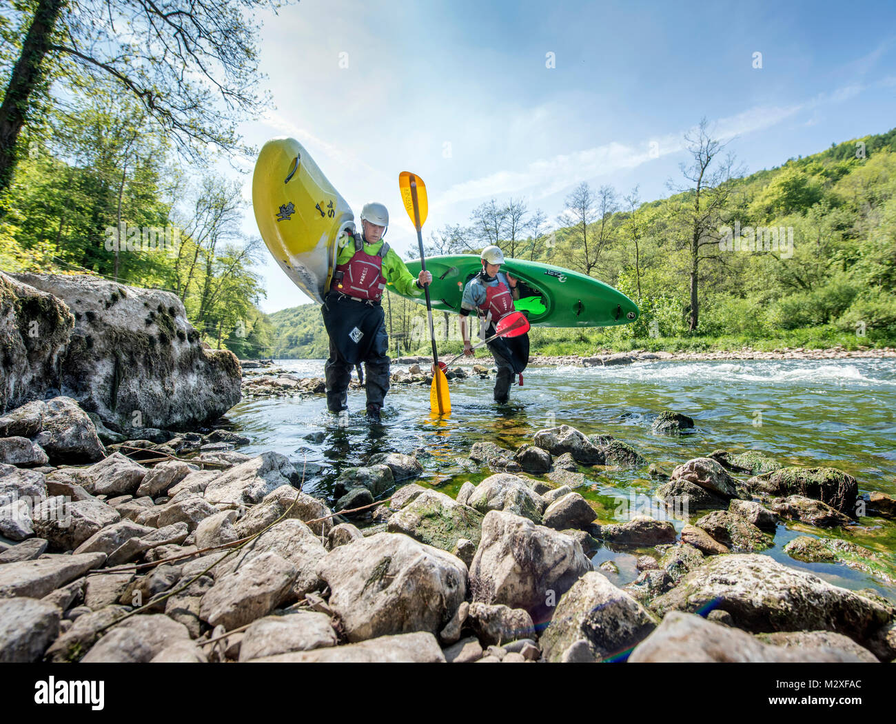 The canoe and kayak coach Ben Matthews (right) after kayaking with a pupil on the River Wye at Symonds Yat in Herefordshire during drought conditions Stock Photo