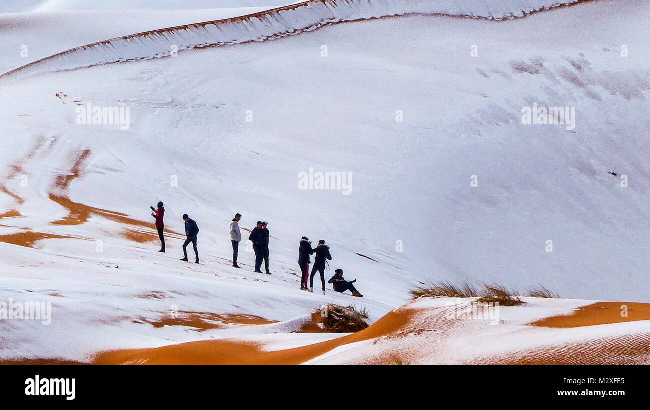 The snow in the Sahara Desert on Tuesday morning (Feb 6th) near Ain Sefra ,Algeria.The snow fell on Monday afternoon but has yet to melt,normally the snow melts within hours of it falling.  Locals were stunned to see snow on the SAND DUNES in the Sahara Desert  after it snowed for the second time this year, following nearly four decades without it. Stock Photo
