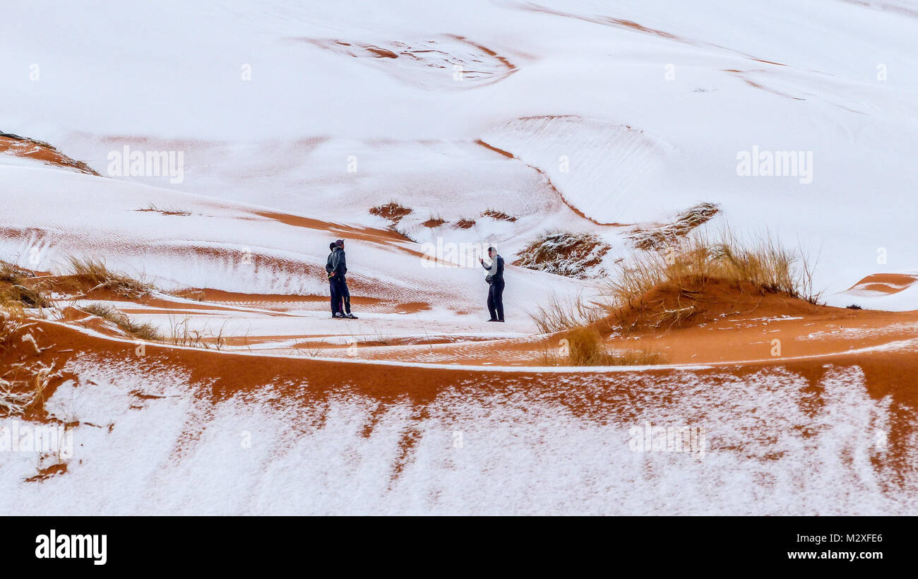 The snow in the Sahara Desert on Tuesday morning (Feb 6th) near Ain Sefra ,Algeria.The snow fell on Monday afternoon but has yet to melt,normally the snow melts within hours of it falling.  Locals were stunned to see snow on the SAND DUNES in the Sahara Desert  after it snowed for the second time this year, following nearly four decades without it. Stock Photo