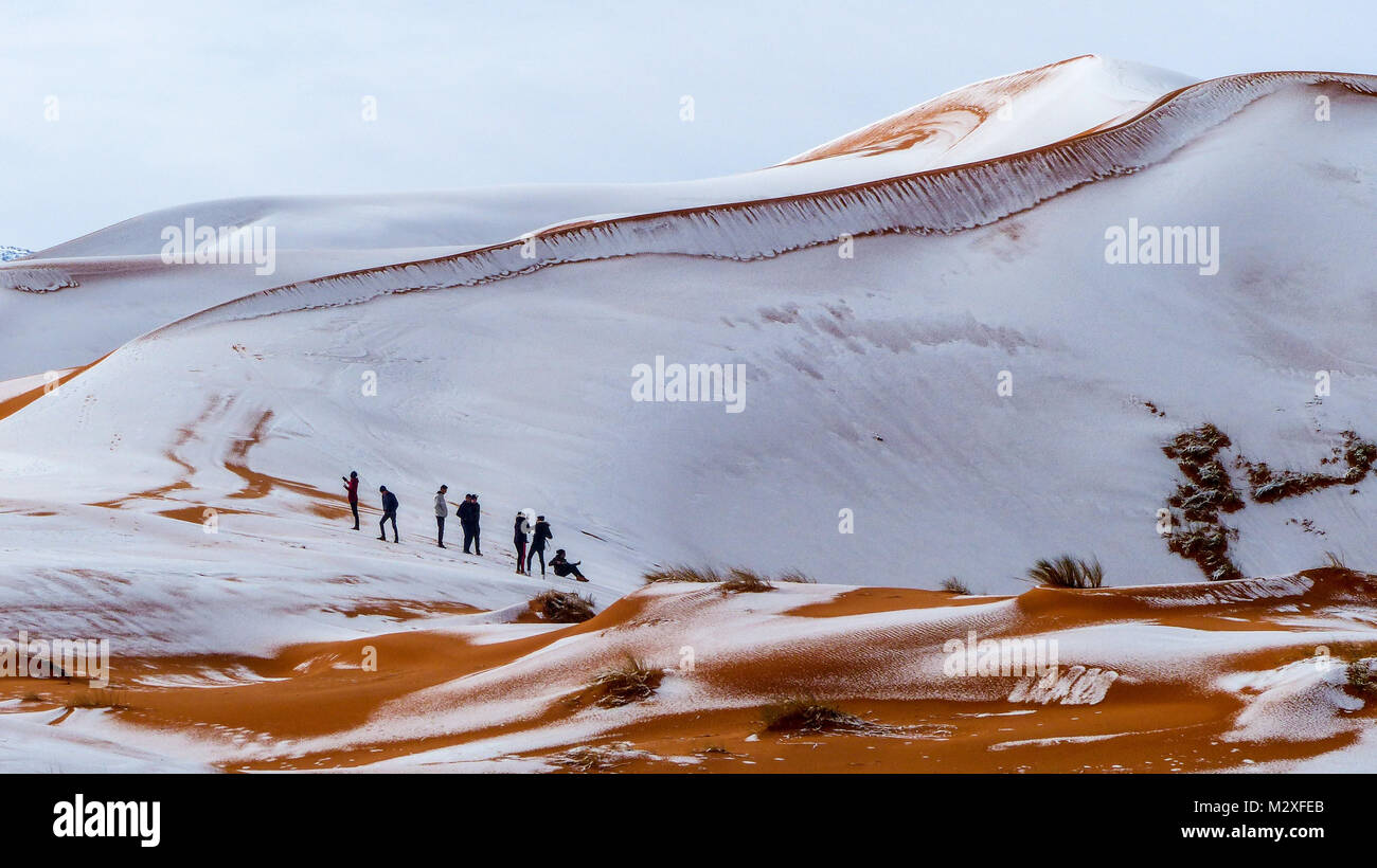 The snow in the Sahara Desert on Tuesday morning (Feb 6th) near Ain Sefra ,Algeria.The snow fell on Monday afternoon but has yet to melt,normally the snow melts within hours of it falling.  Locals were stunned to see snow on the SAND DUNES in the Sahara Desert  after it snowed for the second time this year, following nearly four decades without it. Stock Photo