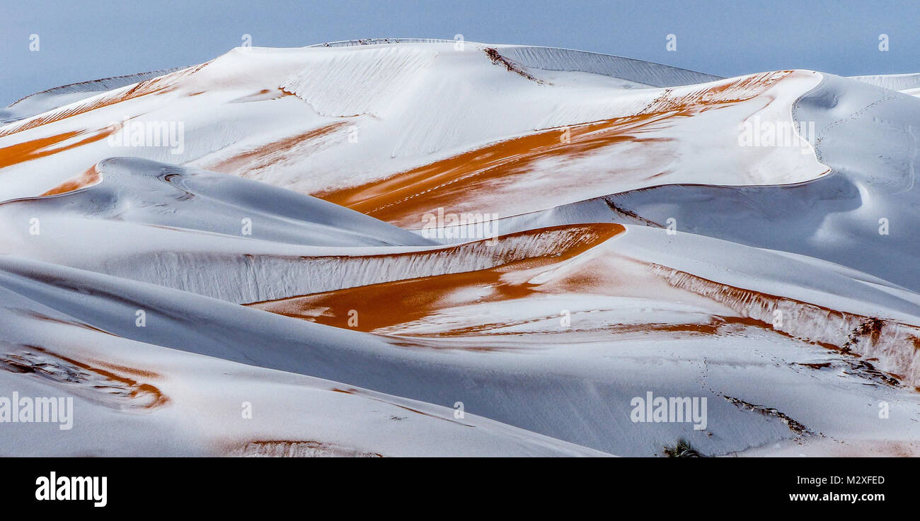 The snow in the Sahara Desert on Tuesday morning (Feb 6th) near Ain Sefra ,Algeria.The snow fell on Monday afternoon but has yet to melt,normally the snow melts within hours of it falling.  Locals were stunned to see snow on the SAND DUNES in the Sahara Desert  after it snowed for the second time this year, following nearly four decades without it. Stock Photo