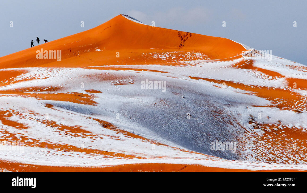 The snow in the Sahara Desert on Tuesday morning (Feb 6th) near Ain Sefra ,Algeria.The snow fell on Monday afternoon but has yet to melt,normally the snow melts within hours of it falling.  Locals were stunned to see snow on the SAND DUNES in the Sahara Desert  after it snowed for the second time this year, following nearly four decades without it. Stock Photo