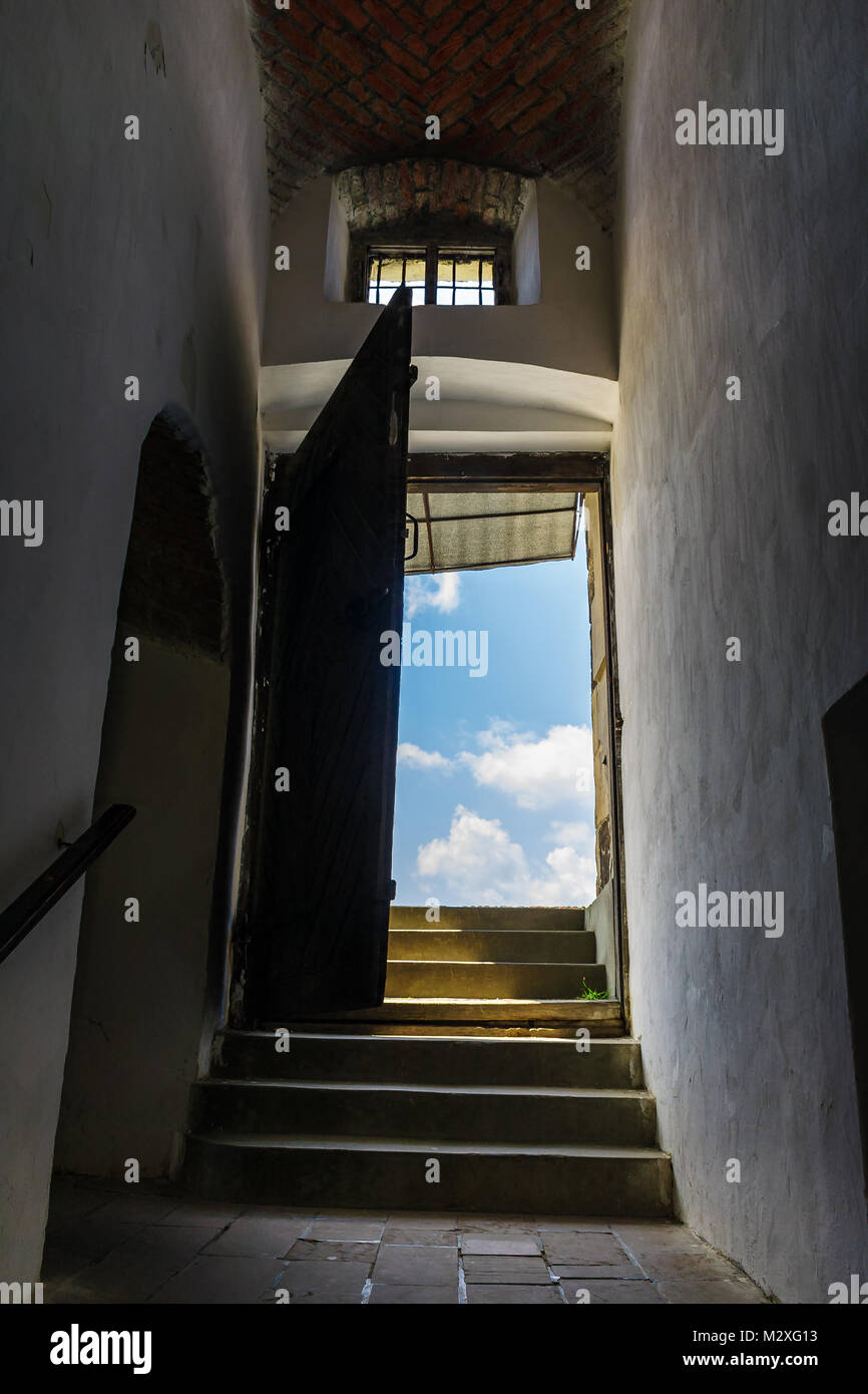 steps through open door in to the sky. view from inside of Palanok castle in Mukachevo, Ukraine Stock Photo